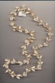 Necklace strung of ring cowries and small conus shells, Philippines, length 35'' 88cm.